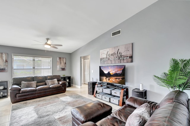 tiled living room featuring ceiling fan and lofted ceiling