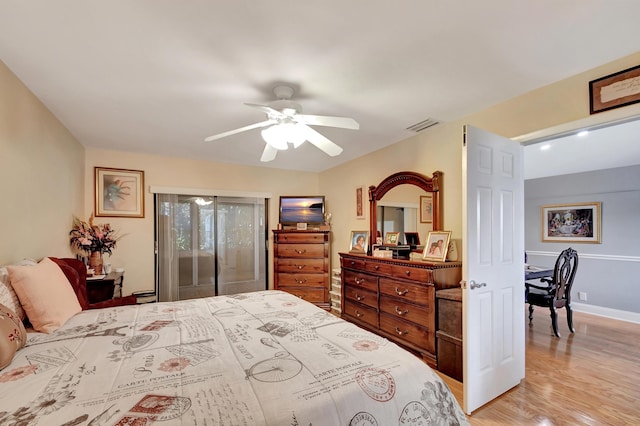 bedroom featuring light hardwood / wood-style flooring and ceiling fan