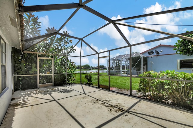 view of patio / terrace featuring glass enclosure