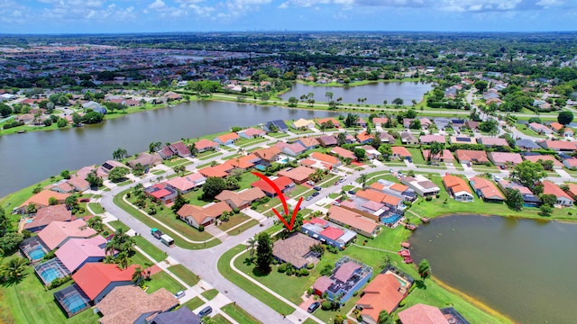 birds eye view of property featuring a water view