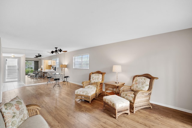 sitting room featuring ceiling fan and light wood-type flooring