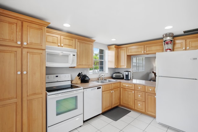 kitchen with white appliances, sink, and light tile patterned floors