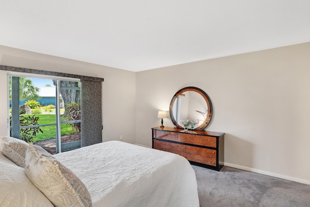 carpeted bedroom featuring access to outside