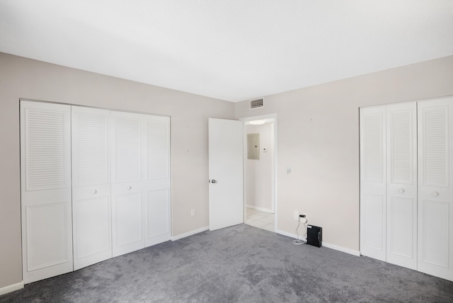 carpeted bedroom featuring ensuite bathroom