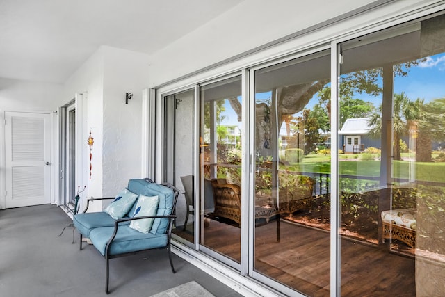 doorway to outside featuring concrete flooring