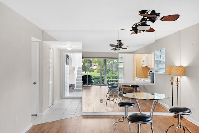 dining room featuring ceiling fan and light wood-type flooring