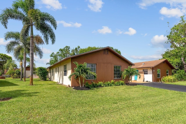 view of property exterior featuring a yard