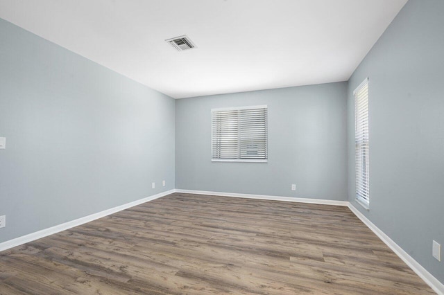 empty room with wood-type flooring