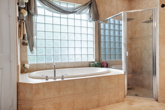 bathroom featuring independent shower and bath and tile patterned floors