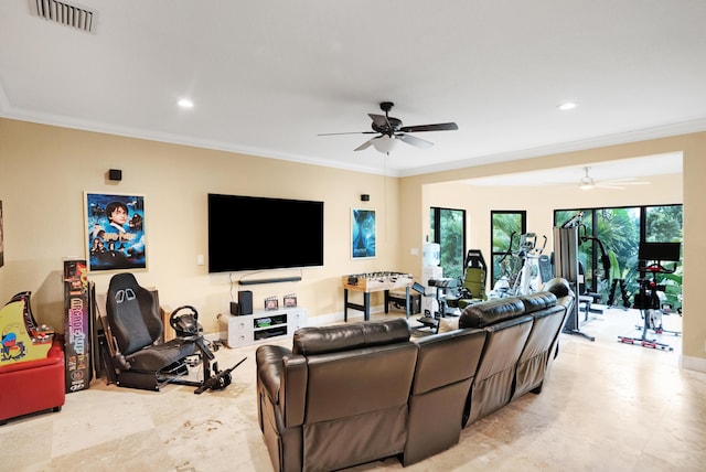 living room with ornamental molding and ceiling fan