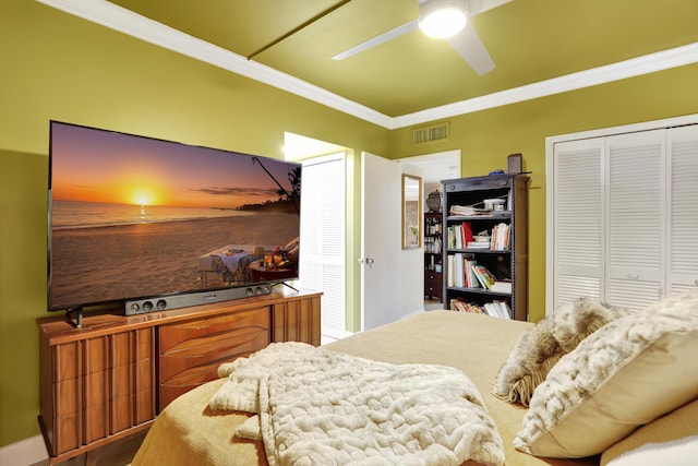 bedroom with ornamental molding and ceiling fan