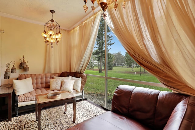 sunroom / solarium featuring a chandelier