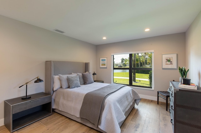 bedroom with light wood-type flooring