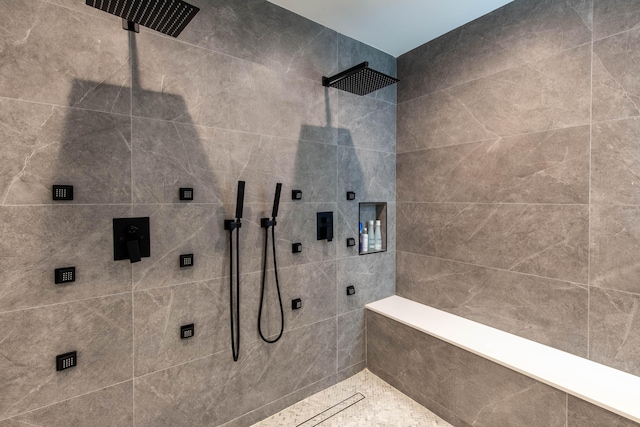 bathroom with tiled shower