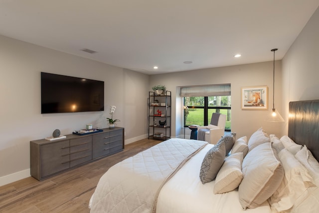 bedroom with light wood-type flooring