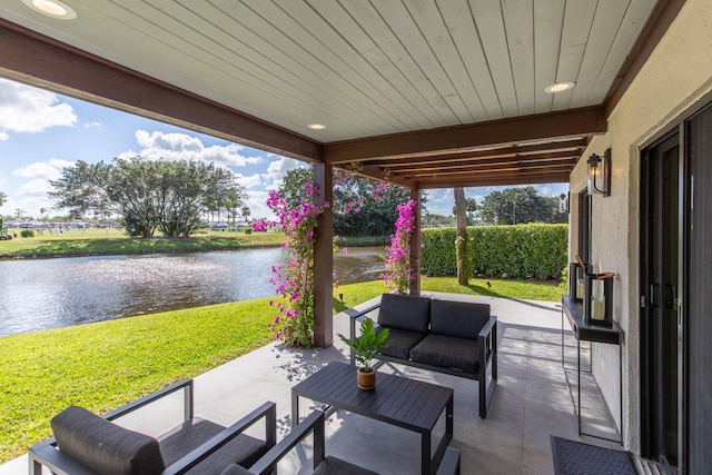 view of patio with a water view and an outdoor hangout area