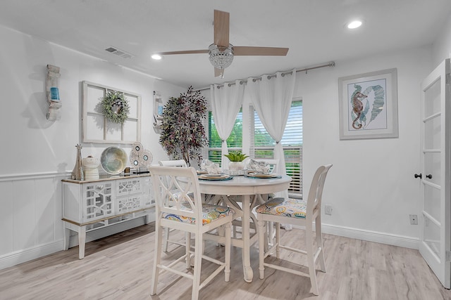 dining area featuring ceiling fan and light hardwood / wood-style flooring