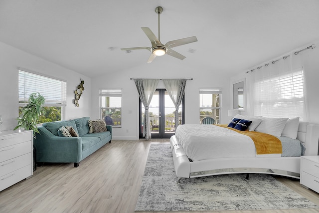 bedroom featuring french doors, vaulted ceiling, ceiling fan, access to exterior, and light hardwood / wood-style floors