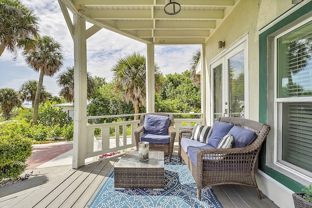 wooden deck featuring outdoor lounge area