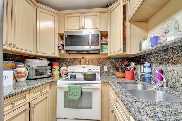 kitchen featuring sink, white electric range, light stone counters, and light brown cabinets