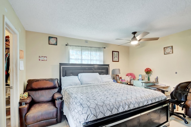 bedroom featuring a textured ceiling and ceiling fan