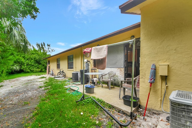 exterior space with a patio area and cooling unit