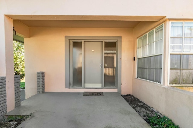 property entrance with a patio area