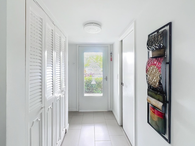 tiled dining room featuring a raised ceiling and ceiling fan