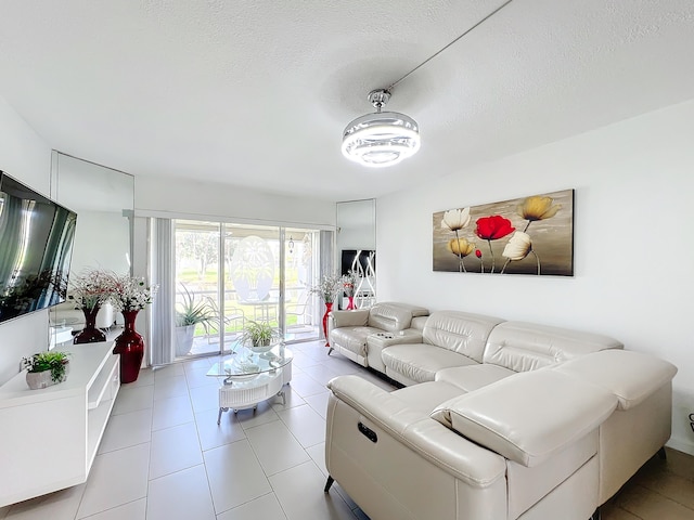 tiled living room with a textured ceiling and ceiling fan