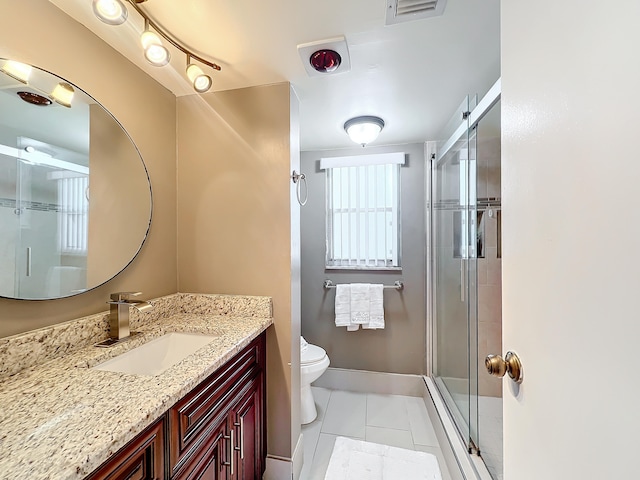 clothes washing area with light tile patterned floors and stacked washer and dryer