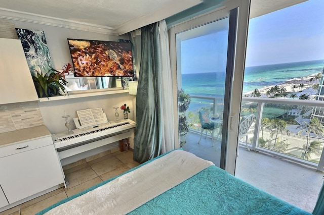 tiled bedroom with a water view and ornamental molding