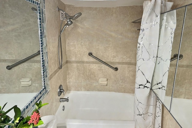 bathroom with tile walls and shower / bath combo with shower curtain