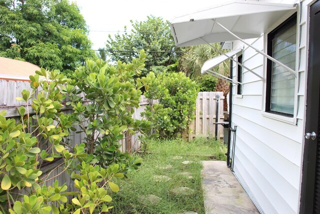 wooden deck featuring outdoor dining area and a fenced backyard