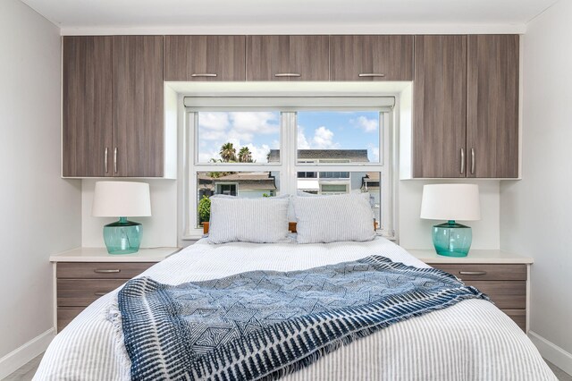 bedroom featuring a water view