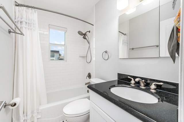 full bathroom with vanity, shower / tub combo with curtain, and toilet