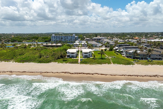 aerial view with a water view and a view of the beach