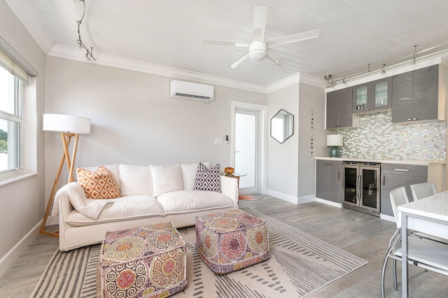 living room featuring wood-type flooring, a wall mounted AC, ceiling fan, beverage cooler, and crown molding