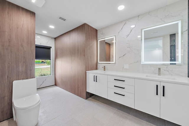 bathroom featuring vanity and toilet