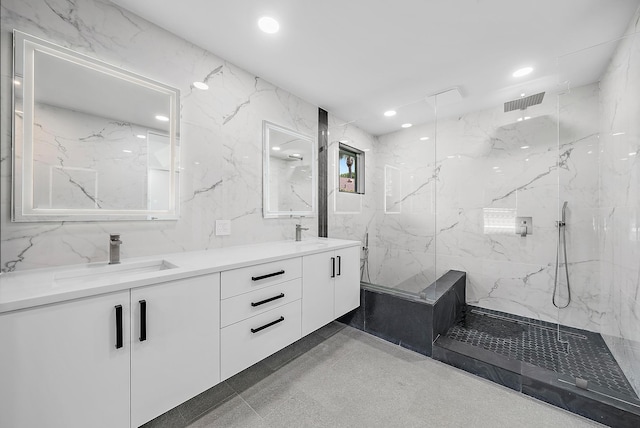 bathroom featuring vanity and tiled shower