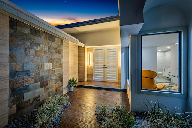 exterior entry at dusk with french doors