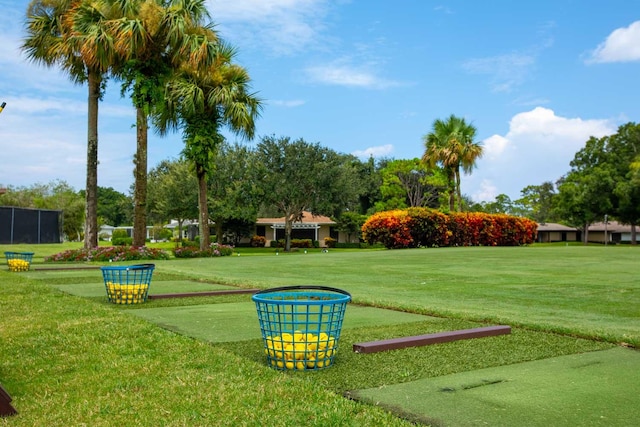 view of property's community with a lawn