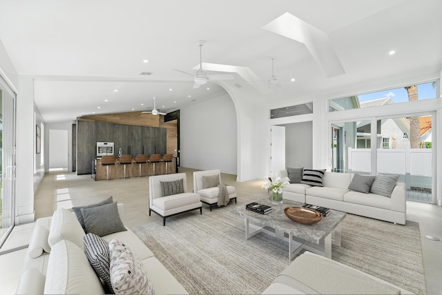 living room featuring high vaulted ceiling and ceiling fan