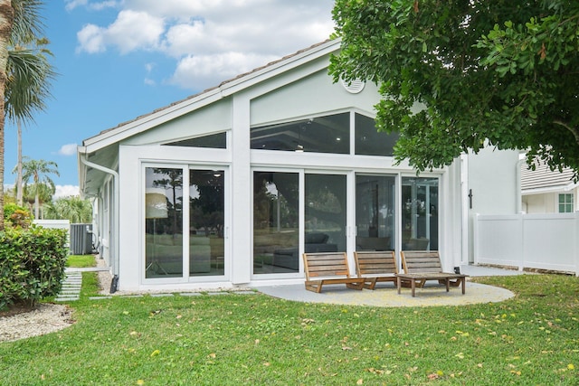 back of house with a patio, central AC, a lawn, and a sunroom