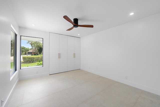 unfurnished bedroom featuring ceiling fan