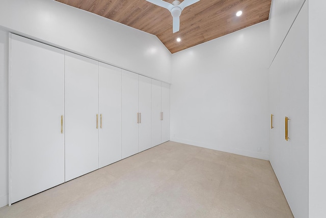 interior space with vaulted ceiling, wooden ceiling, and a closet