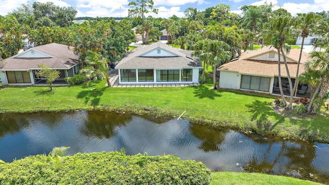 exterior space with a sunroom and a water view