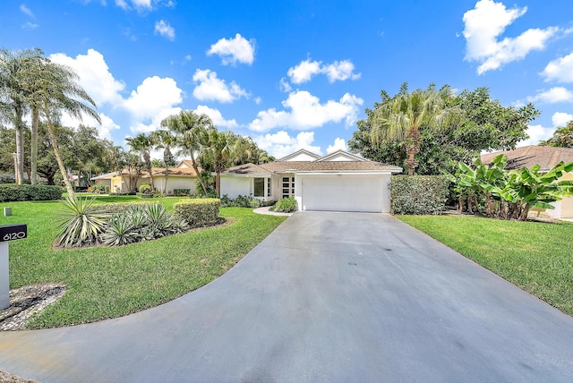 ranch-style house with a front yard and a garage