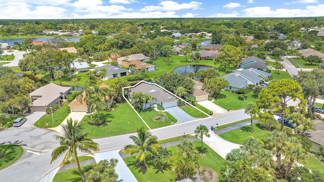 birds eye view of property with a water view