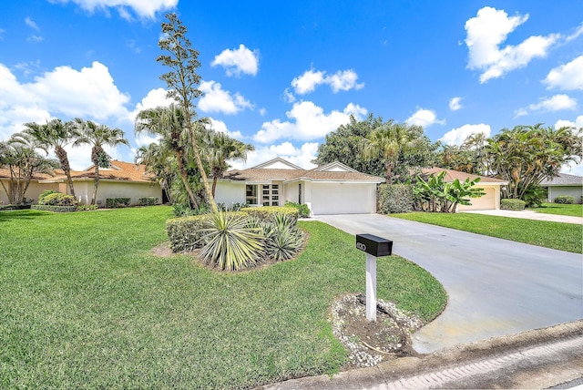 single story home featuring a garage and a front lawn