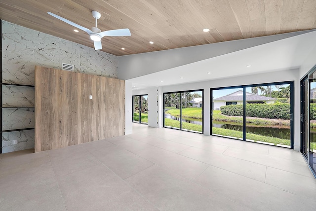 empty room with lofted ceiling, wood ceiling, and ceiling fan